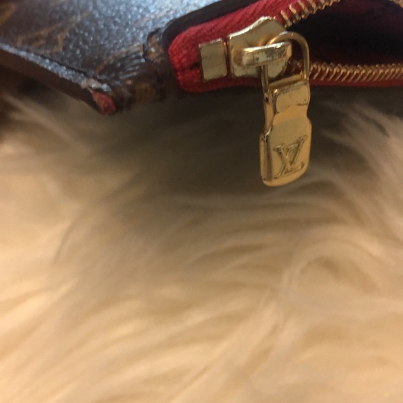 LV wristlet from World Tour collection. Authentic